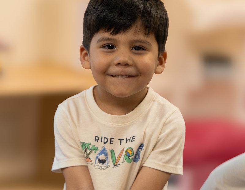 Toddler smiling in the classroom at Victory Academy, a Christian toddler preschool in Raleigh NC